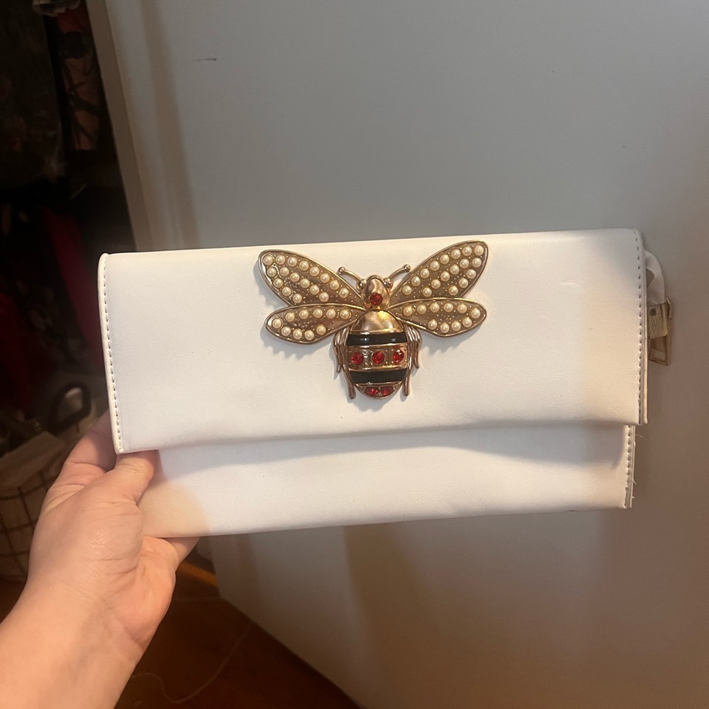 Elegant White Clutch with Gold Bee Accent